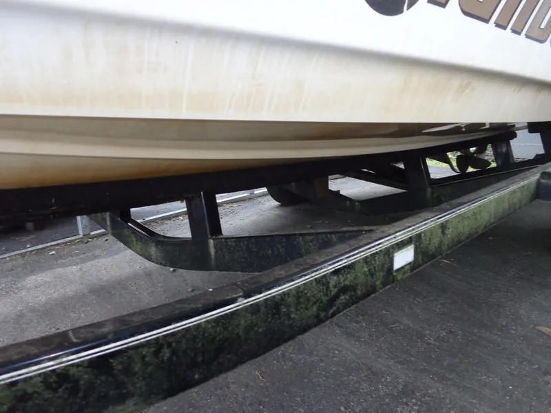Slide: The Image of 1998 Malibu Sunsetter VLX boat on a trailer, close-up view. - 22