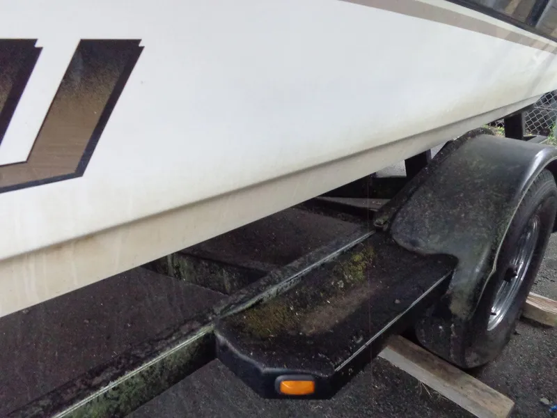 Slide: The Image of Close-up of a 1998 Malibu Sunsetter VLX boat on a trailer. - 23