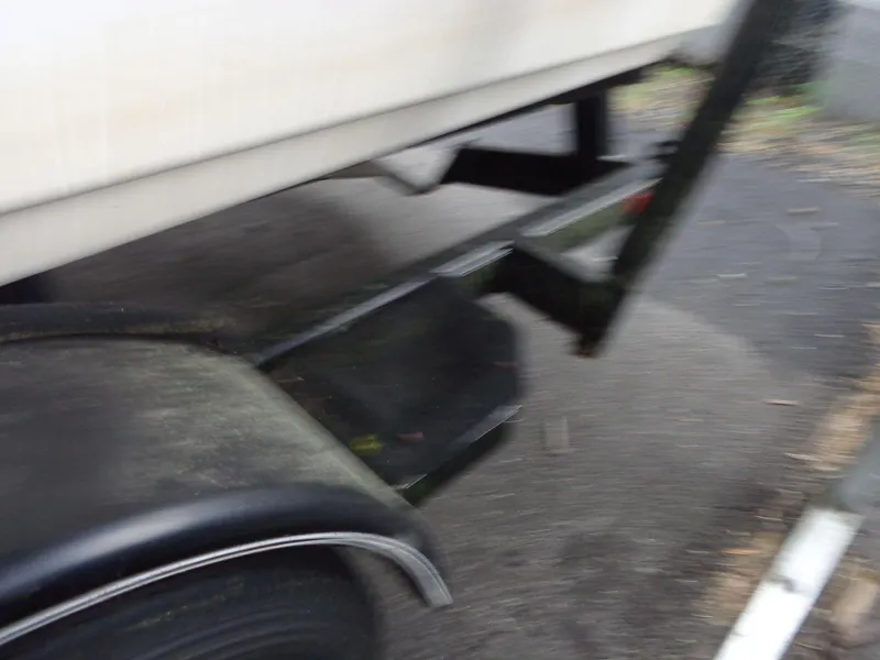 Slide: The Image of Blurry image of a 1998 Malibu Sunsetter VLX boat trailer. - 24