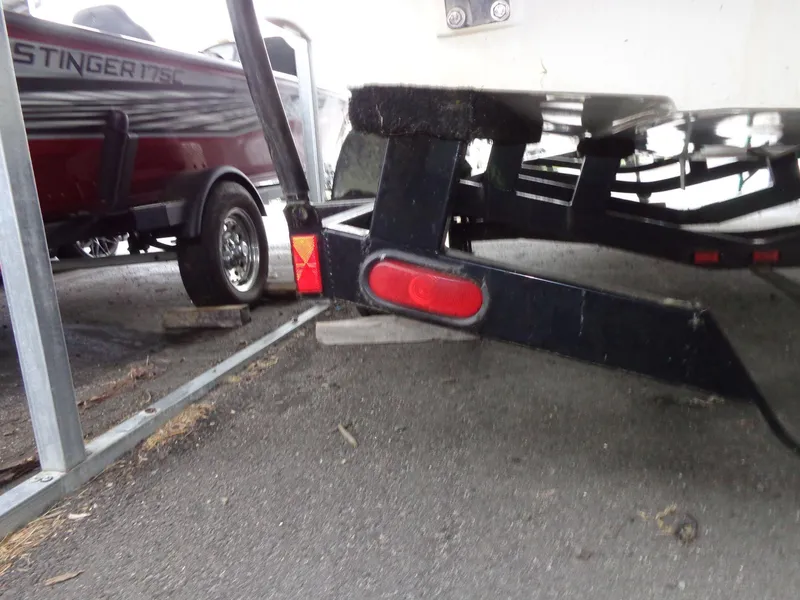 Slide: The Image of Close-up of a 1998 Malibu Sunsetter VLX boat trailer with red reflector light. - 27