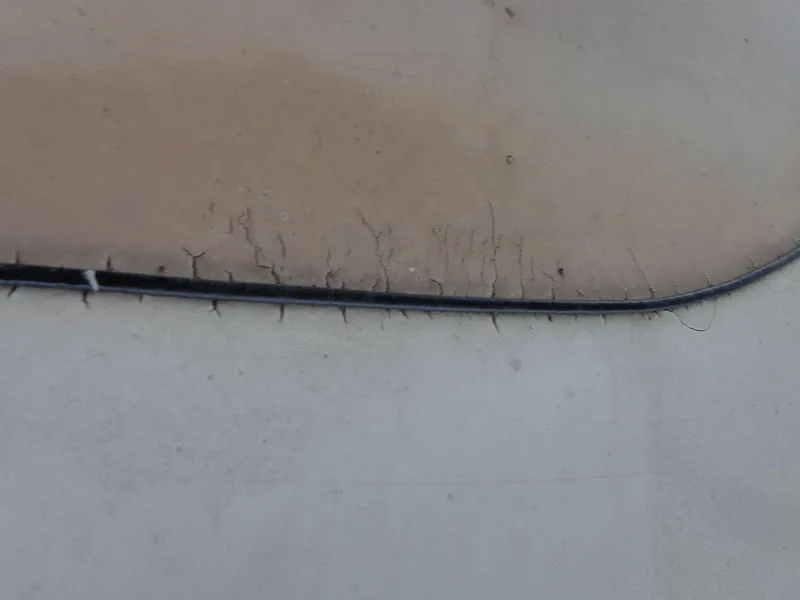 Slide: The Image of Close-up of cracked surface on 1998 Malibu Sunsetter VLX boat. - 30