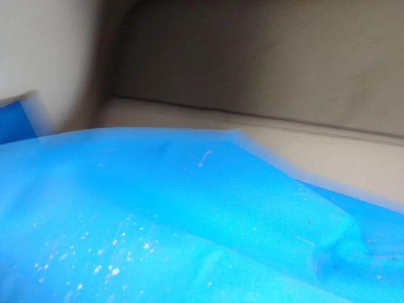 Slide: The Image of Blurred interior of a 1998 Malibu Sunsetter VLX with blue fabric. - 33
