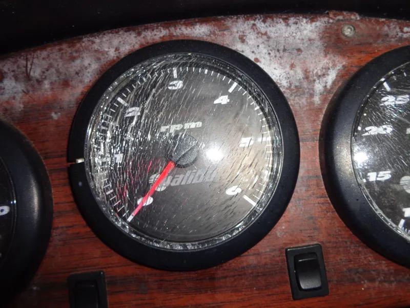 Slide: The Image of Cracked RPM gauge on 1998 Malibu Sunsetter VLX dashboard. - 47