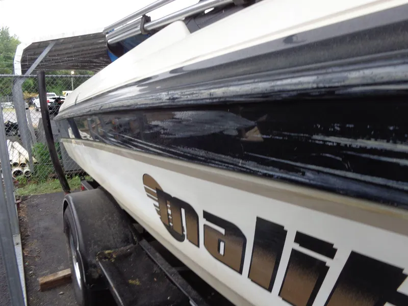 Slide: The Image of 1998 Malibu Sunsetter VLX boat on trailer, side view. - 6