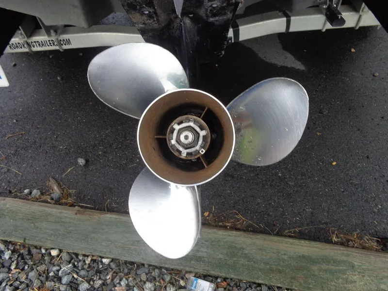 Slide: The Image of Close-up of a 2007 Sea Ray 200 Sundeck boat propeller on a trailer. - 13