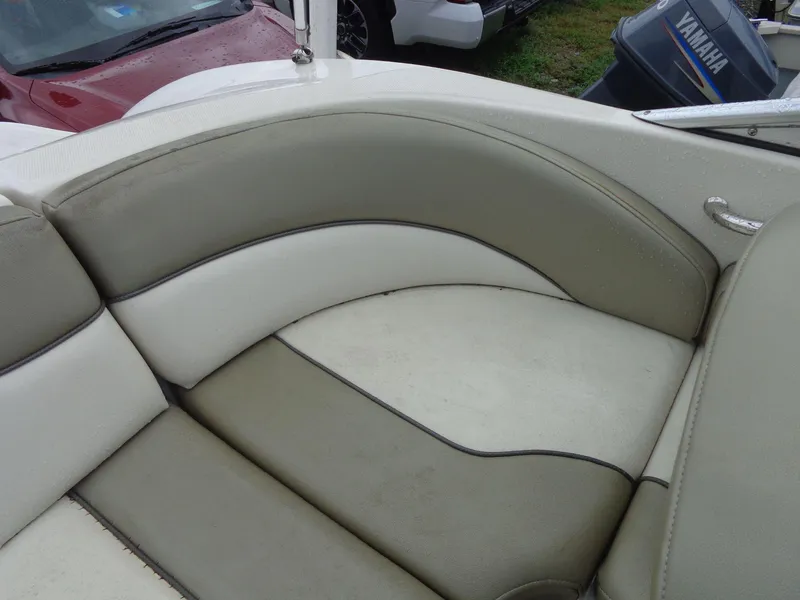 Slide: The Image of 2007 Sea Ray 200 Sundeck boat seating with beige and white upholstery. - 27