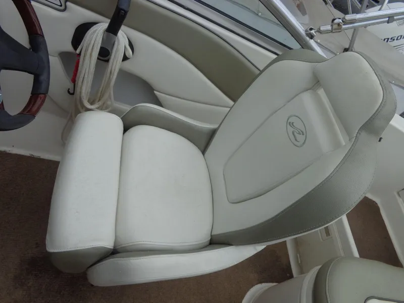 Slide: The Image of 2007 Sea Ray 200 Sundeck boat seat with steering wheel and rope detail. - 32