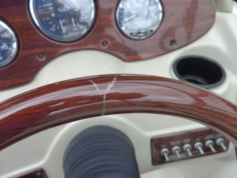 Slide: The Image of Close-up of 2007 Sea Ray 200 Sundeck dashboard with wooden steering wheel and gauges. - 35