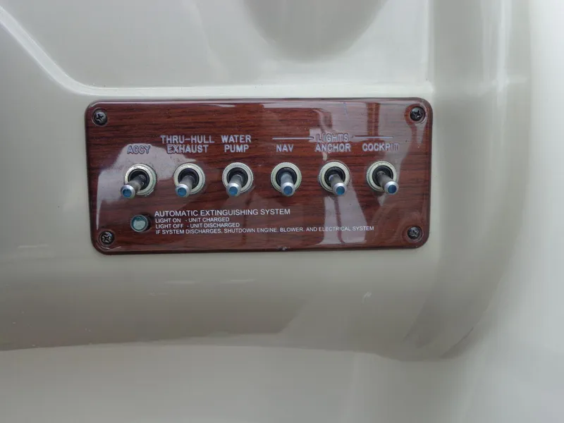 Slide: The Image of Control panel of a 2007 Sea Ray 200 Sundeck boat with labeled switches. - 38