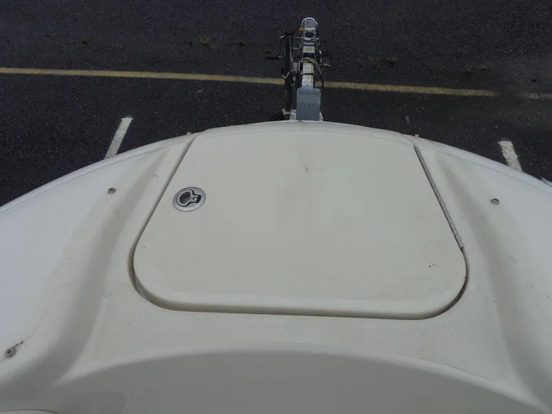 Slide: The Image of 2007 Sea Ray 200 Sundeck boat bow with closed hatch, parked on trailer. - 47