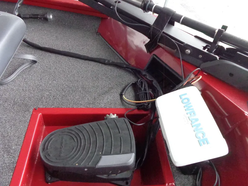 Slide: The Image of 2020 Lowe Stinger 175C boat interior with Lowrance equipment and foot pedal. - 21