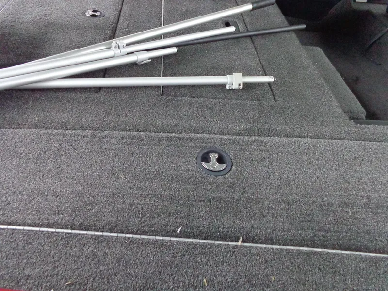 Slide: The Image of 2020 Lowe Stinger 175C boat deck with metal poles and latch. - 29