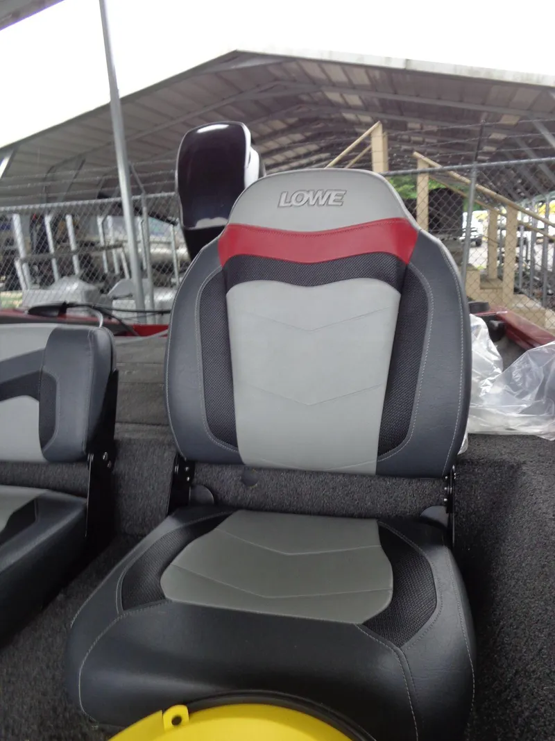 Slide: The Image of 2020 Lowe Stinger 175C boat seat with red and gray design. - 31