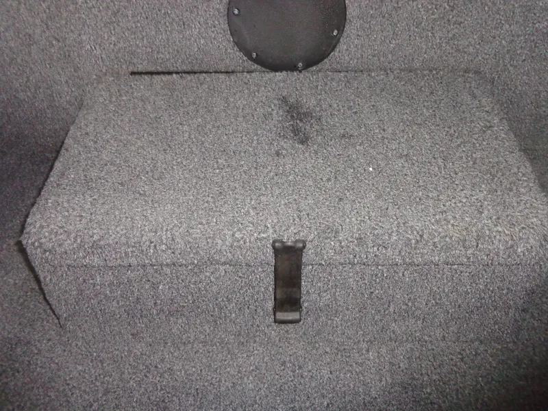 Slide: The Image of Carpeted storage compartment in a 2020 Lowe Stinger 175C boat. - 32