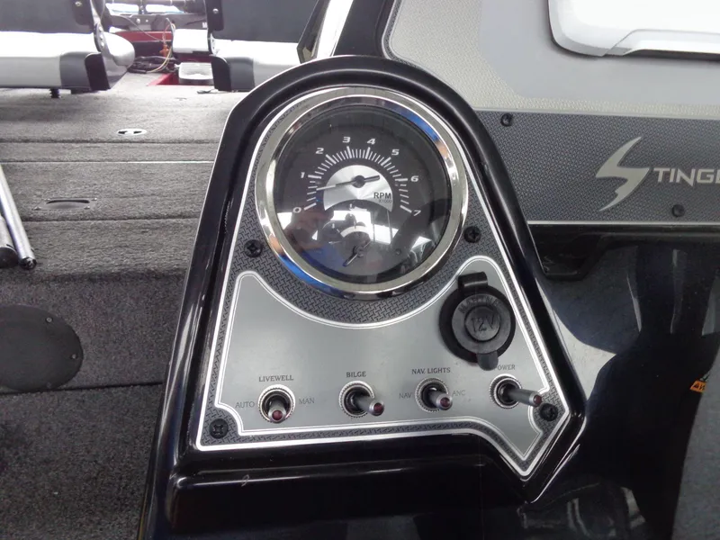 Slide: The Image of 2020 Lowe Stinger 175C dashboard with RPM gauge and control switches. - 34