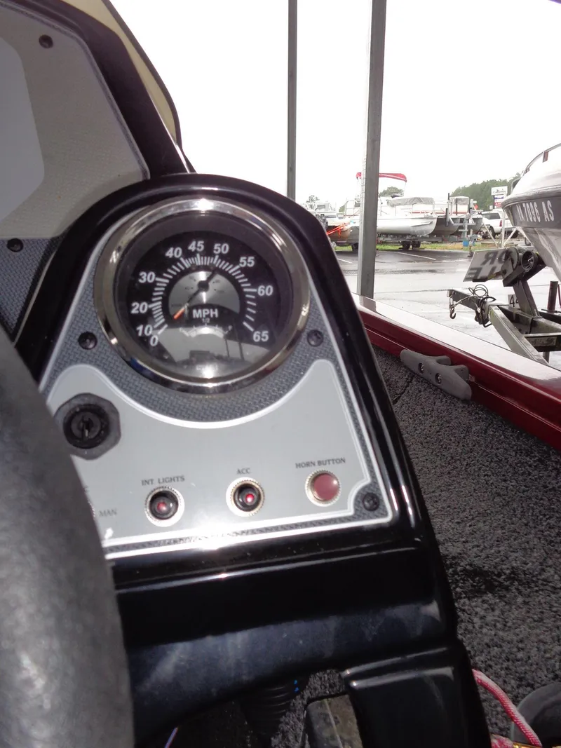 Slide: The Image of Dashboard of a 2020 Lowe Stinger 175C boat with speedometer and controls. - 35