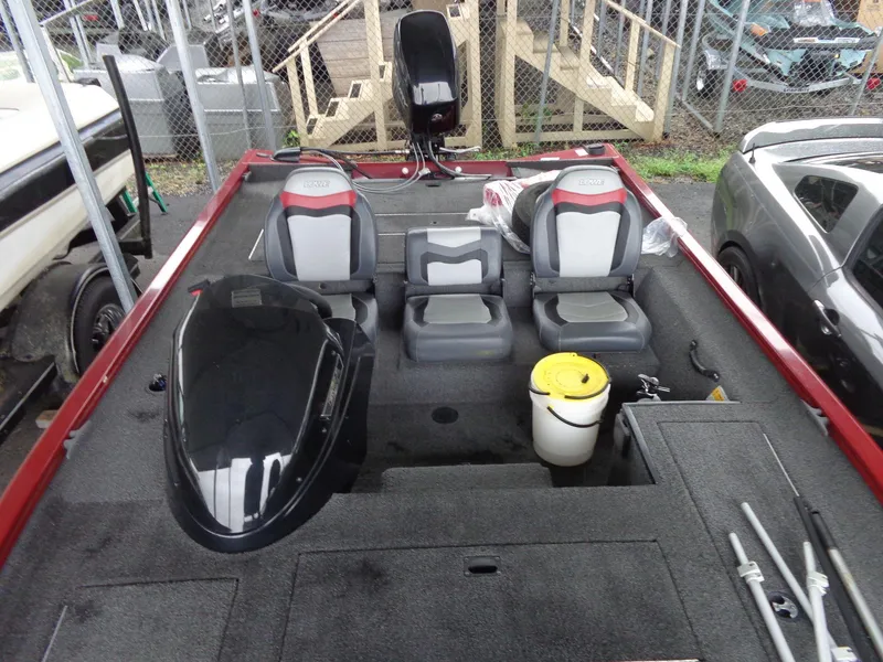Slide: The Image of 2020 Lowe Stinger 175C boat interior with seating and storage compartments. - 38