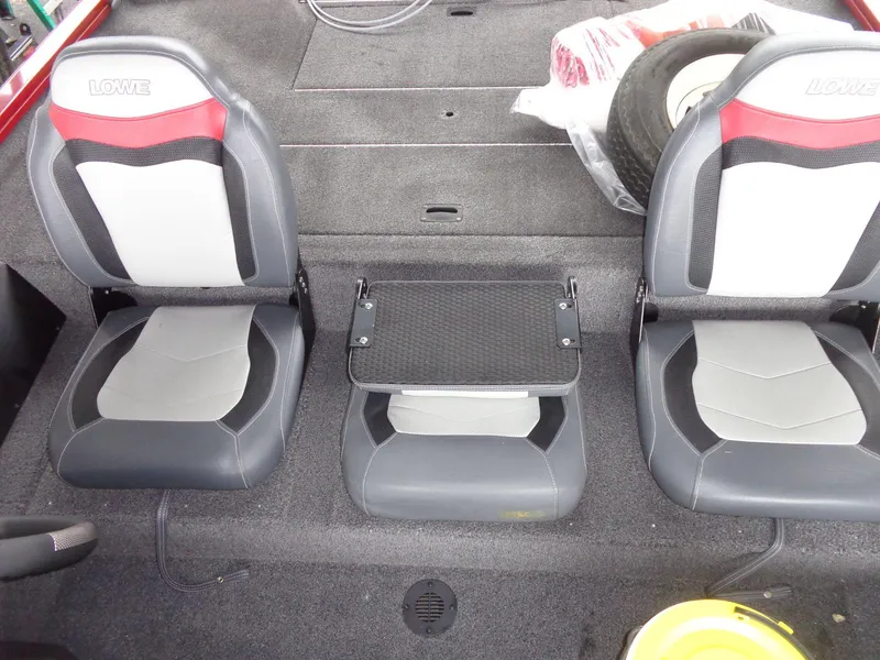Slide: The Image of 2020 Lowe Stinger 175C boat interior with two seats and storage area. - 39