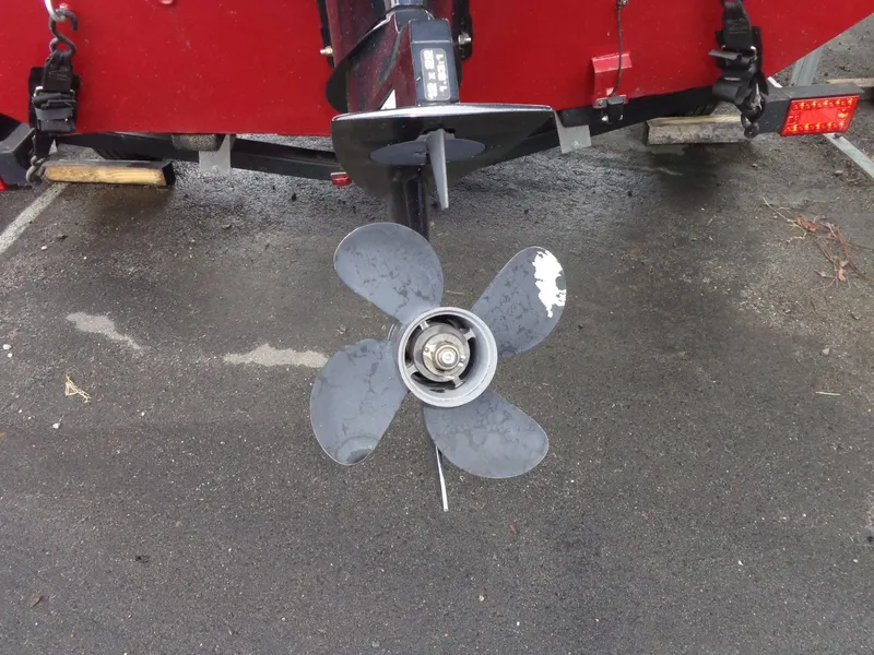 Slide: The Image of 2020 Lowe Stinger 175C boat propeller on wet pavement. - 4