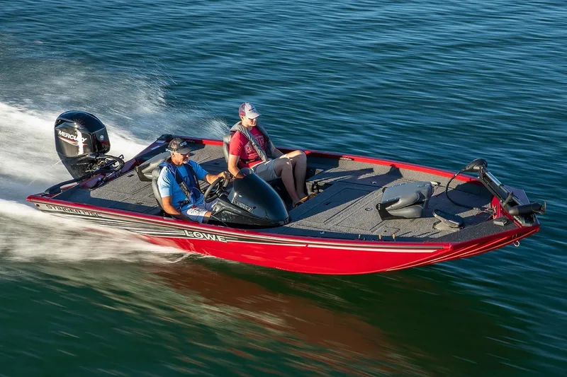 Slide: The Image of 2020 Lowe Stinger 175C boat speeding on water, featuring two passengers. - 42