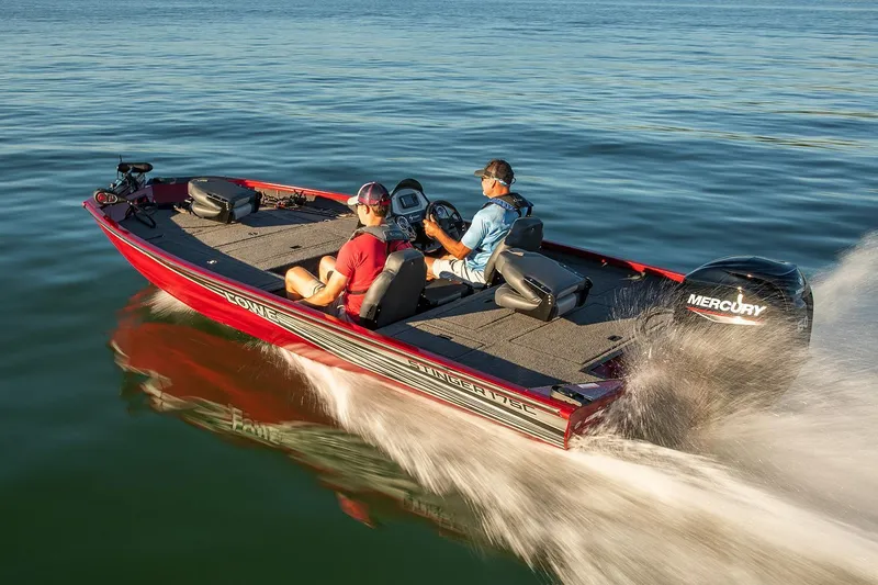 Slide: The Image of 2020 Lowe Stinger 175C boat cruising on a lake with two passengers. - 44