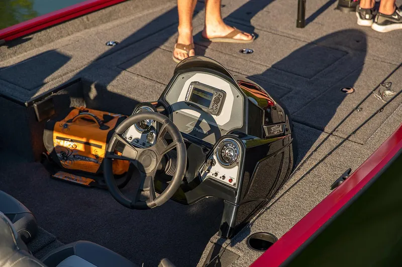 Slide: The Image of 2020 Lowe Stinger 175C boat interior with steering wheel and dashboard. - 47