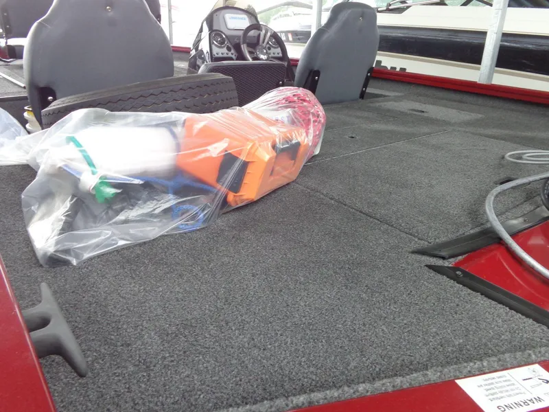 Slide: The Image of 2020 Lowe Stinger 175C boat interior with packaged equipment on deck. - 6