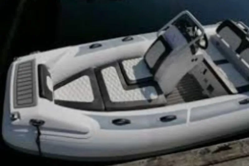 Slide: The Image of 2026 Highfield Sport460 boat with sleek design and modern seating on calm water. - 6