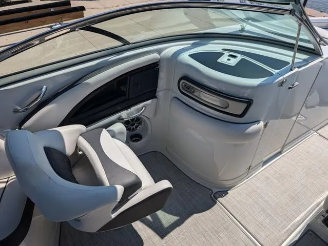 Slide: The Image of 2022 Crownline 255 SS boat interior with sleek dashboard and comfortable seating. - 12