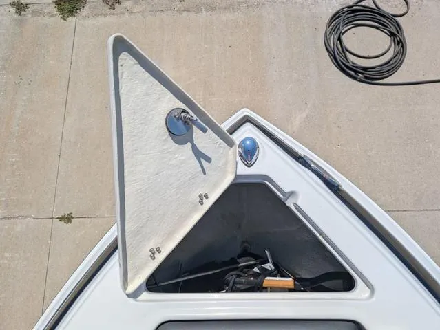 Slide: The Image of Open storage compartment on 2022 Crownline 255 SS boat, viewed from above. - 14