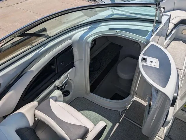 Slide: The Image of 2022 Crownline 255 SS boat interior with seating and cabin entrance. - 19