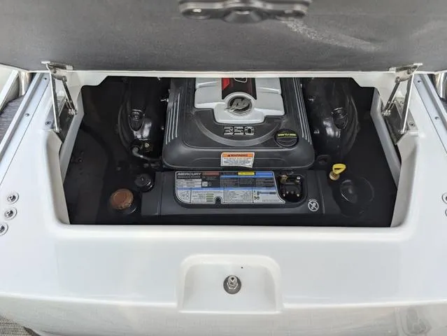 Slide: The Image of 2022 Crownline 255 SS boat engine compartment with Mercury 350 engine. - 22