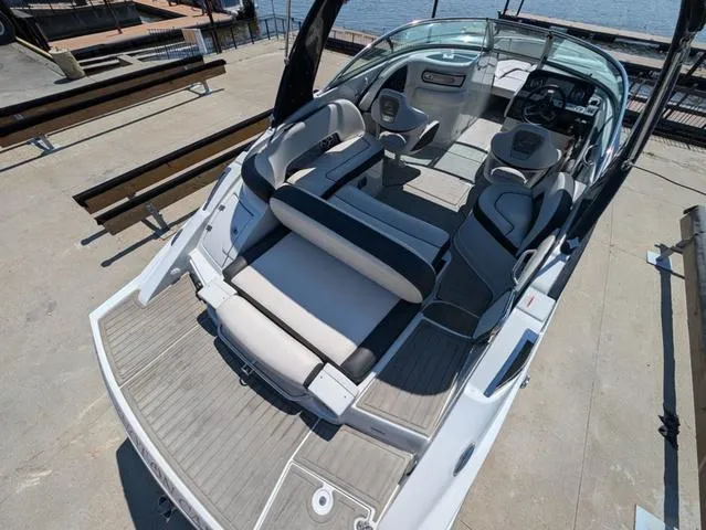 Slide: The Image of 2022 Crownline 255 SS boat with spacious seating and modern design. - 5