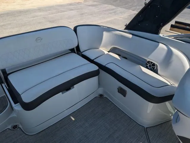 Slide: The Image of 2022 Crownline 255 SS boat interior with white and black seating. - 9