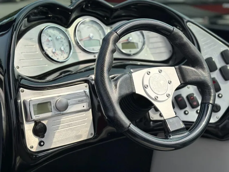 Slide: The Image of Close-up of 2016 Sanger 237LTZ boat dashboard with steering wheel and gauges. - 11