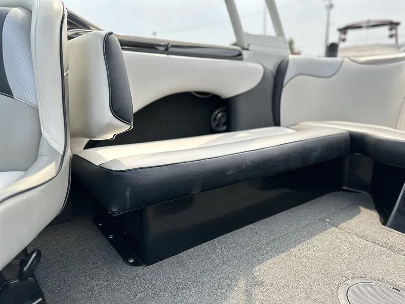 Slide: The Image of 2016 Sanger 237LTZ boat interior with black and white seating. - 15