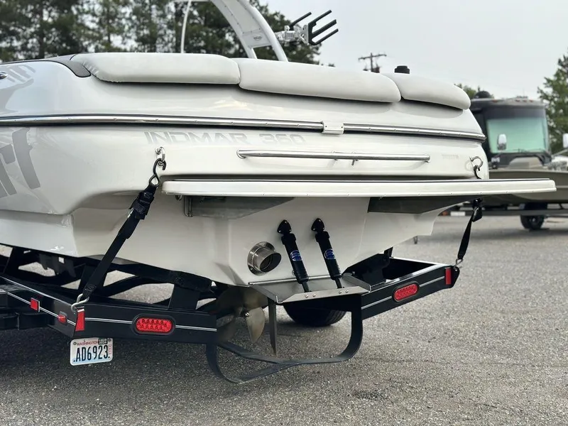 Slide: The Image of 2016 Sanger 237LTZ boat rear view on trailer, showcasing propeller and exhaust. - 3