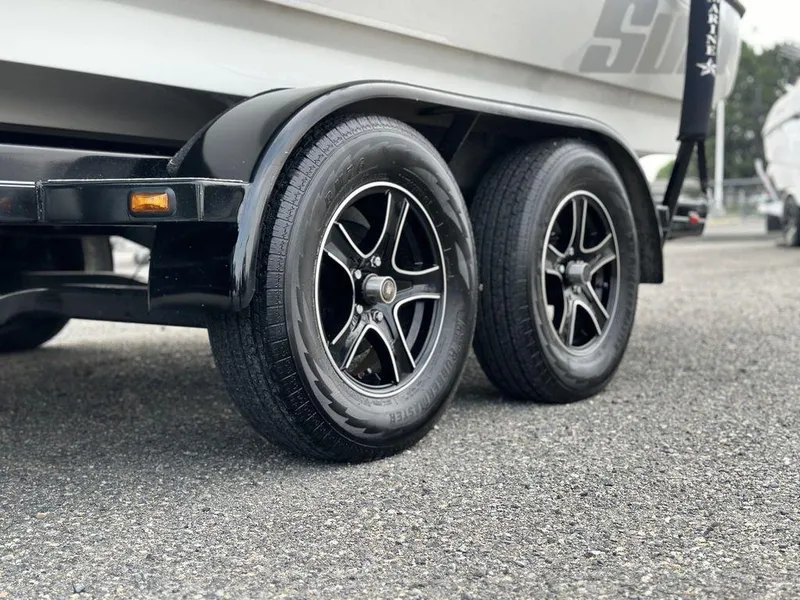 Slide: The Image of Close-up of 2016 Sanger 237LTZ trailer wheels on asphalt. - 4