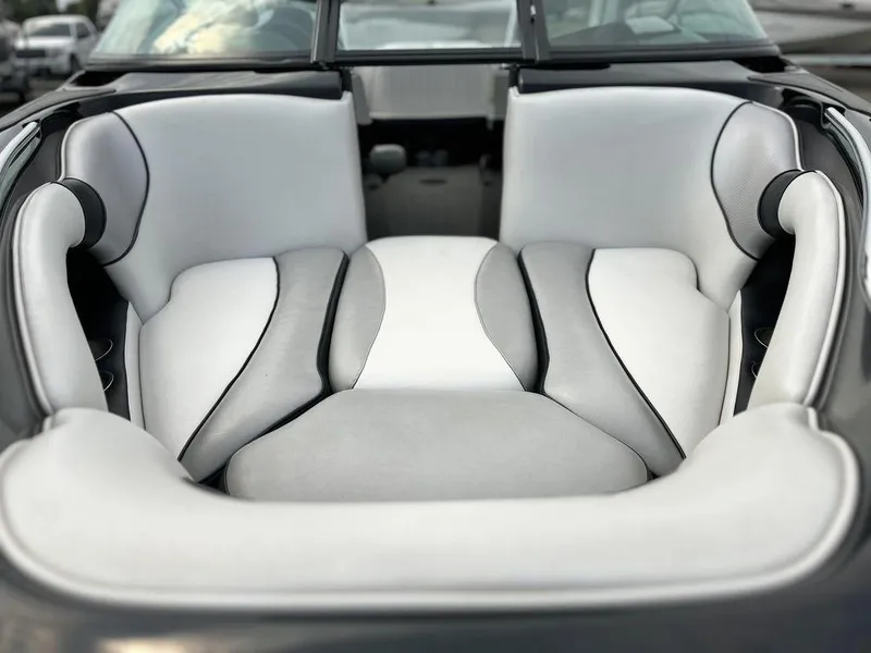 Slide: The Image of 2016 Sanger 237LTZ boat interior with white and gray seating. - 6