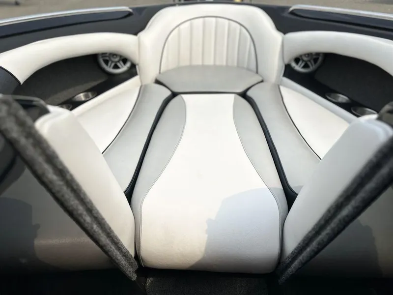 Slide: The Image of 2016 Sanger 237LTZ boat interior with sleek white and gray seating. - 7