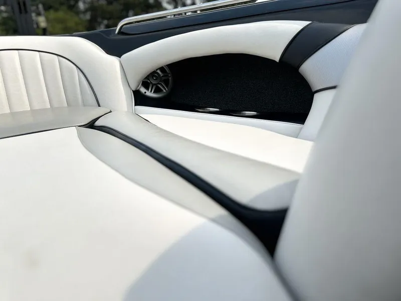 Slide: The Image of 2016 Sanger 237LTZ boat interior with white and black upholstery. - 8