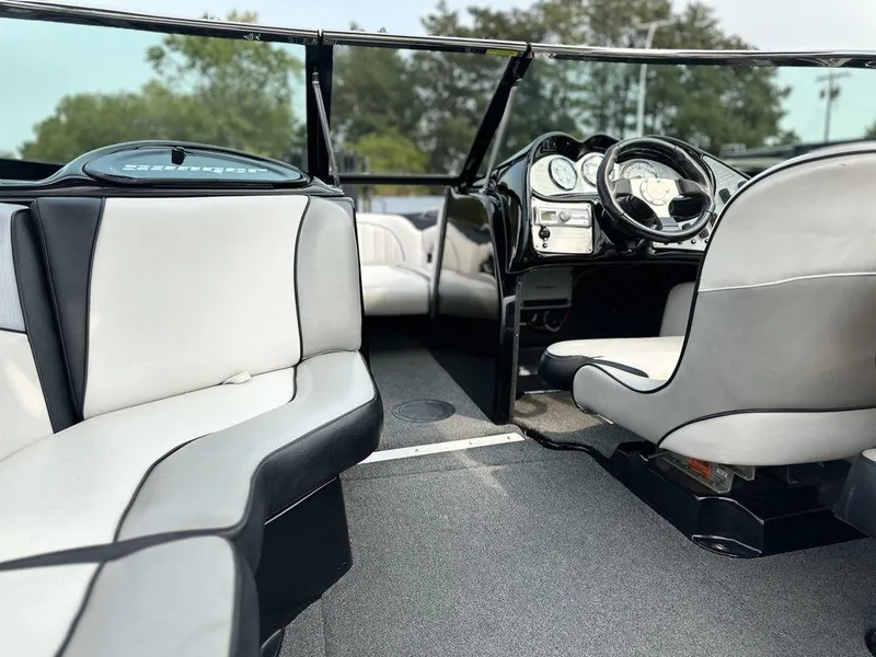 Slide: The Image of Interior of 2016 Sanger 237LTZ boat with sleek seating and modern dashboard. - 9