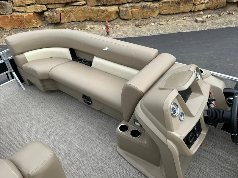 Slide: The Image of 2024 Starcraft LX 22 F boat interior with beige seating and modern dashboard. - 12