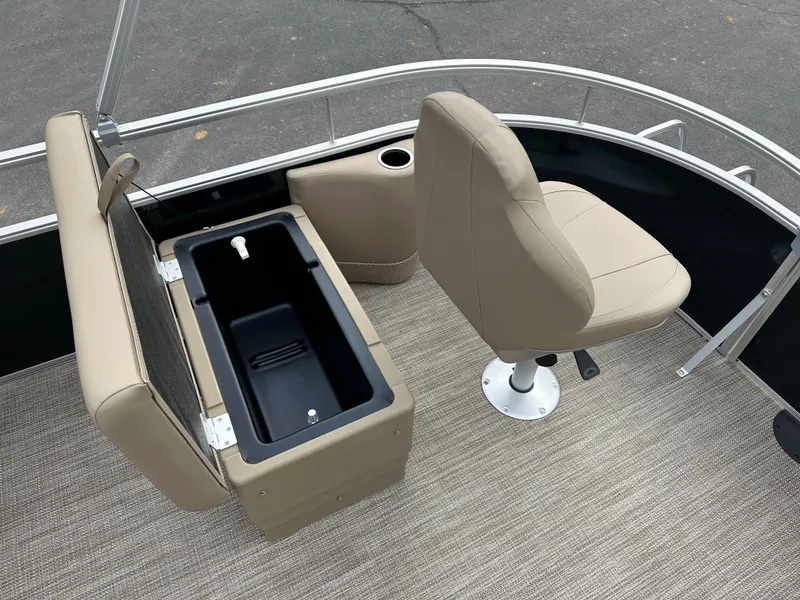 Slide: The Image of 2024 Starcraft LX 22 F boat interior with beige seating and storage compartment. - 20