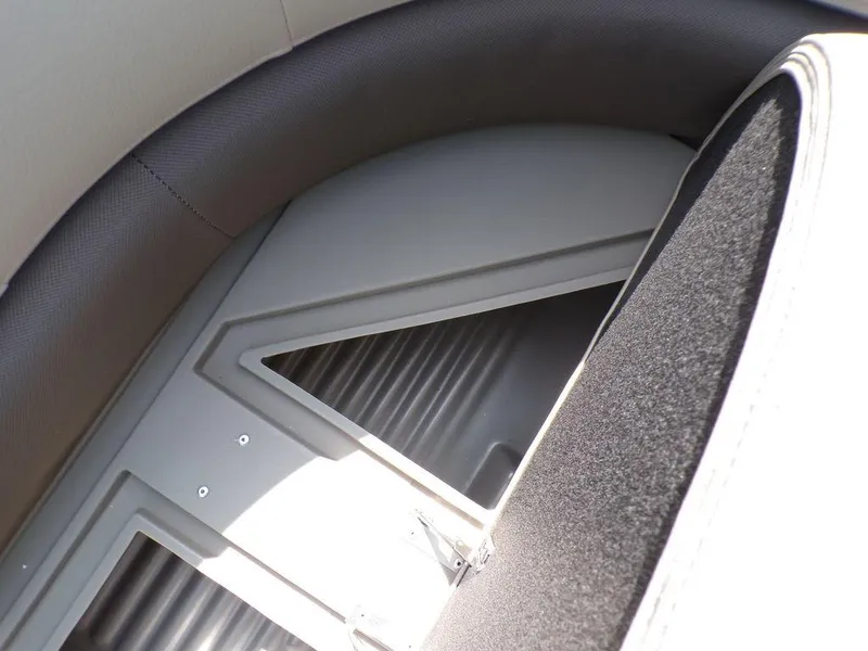 Slide: The Image of 2024 Sun Tracker BASS BUGGY® 18 DLX interior seating detail with storage compartment. - 13