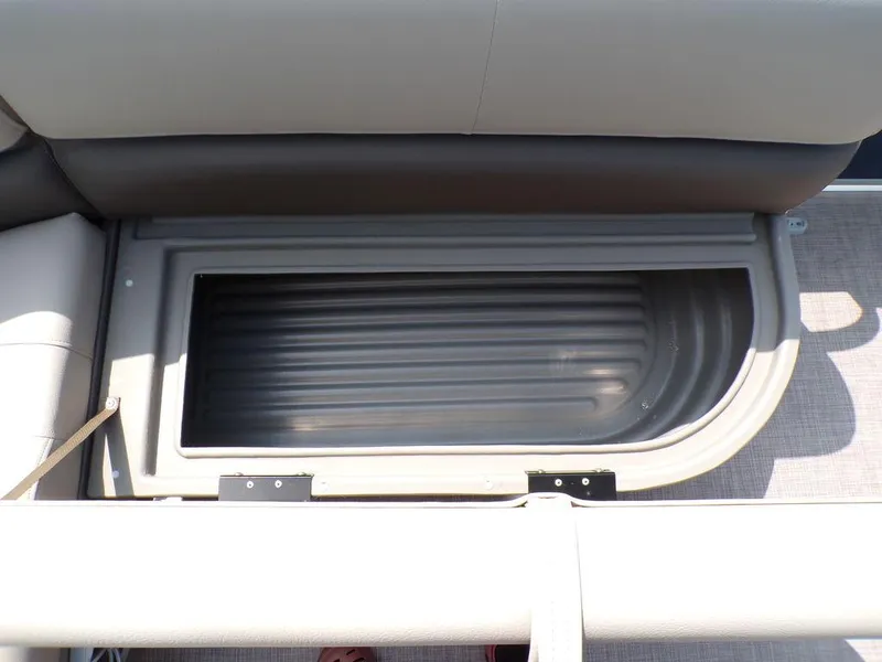 Slide: The Image of 2024 Sun Tracker BASS BUGGY® 18 DLX storage compartment with cushioned seating. - 14