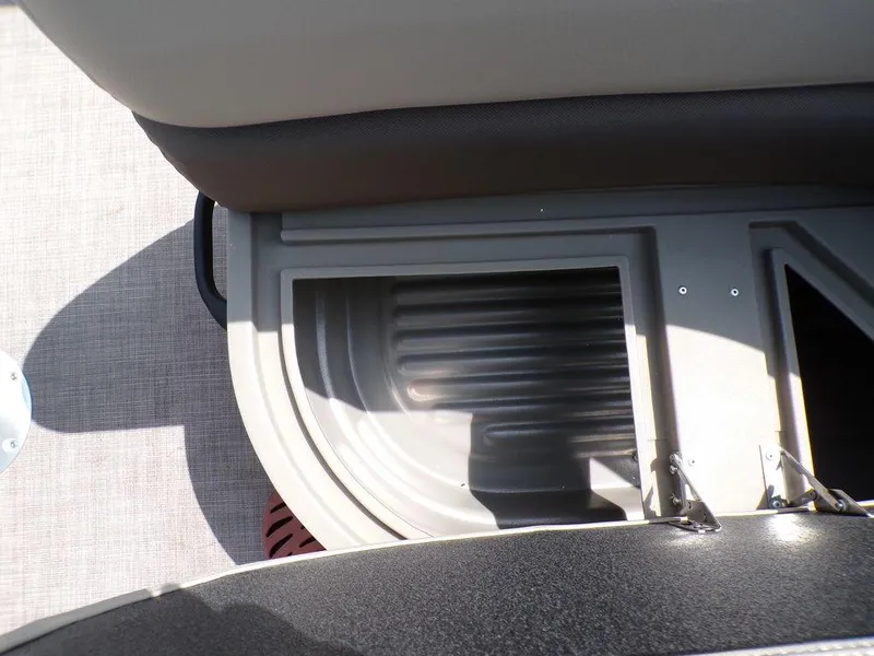 Slide: The Image of 2024 Sun Tracker BASS BUGGY® 18 DLX interior storage compartment with textured flooring. - 20