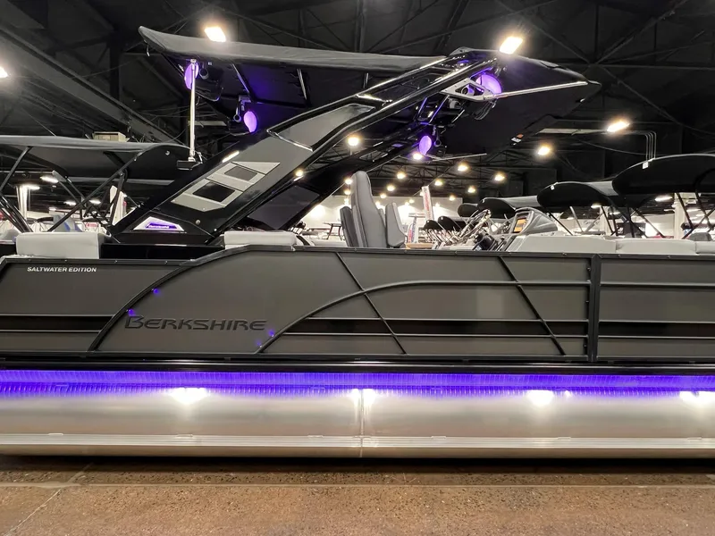 Slide: The Image of 2025 Berkshire 25RFX Roswell Arch STS Tritoon with purple LED lights in showroom. - 10