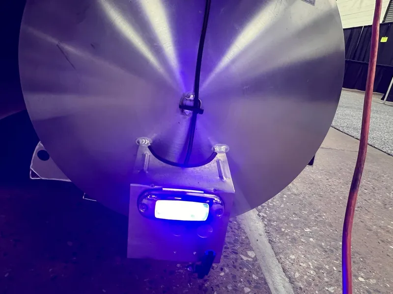 Slide: The Image of Close-up of 2025 Berkshire 25RFX Roswell Arch STS Tritoon with illuminated blue light. - 12