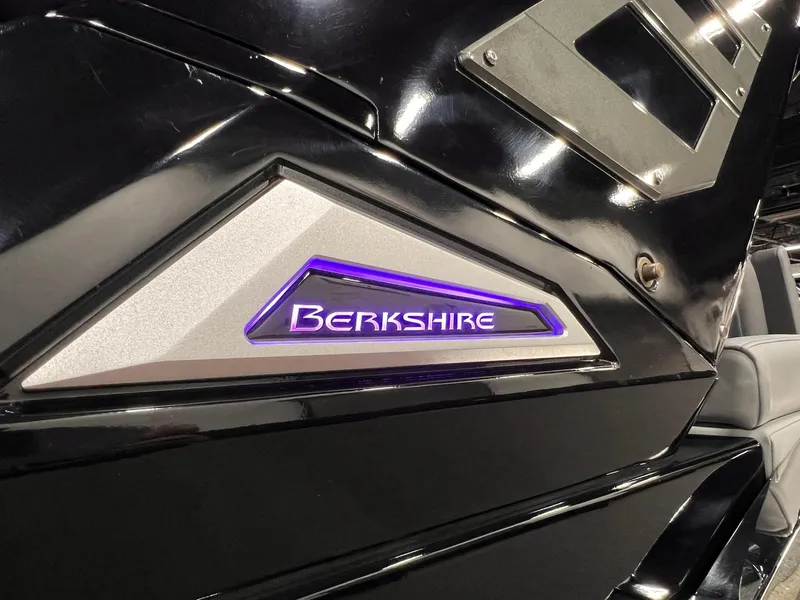 Slide: The Image of 2025 Berkshire 25RFX Roswell Arch STS Tritoon with illuminated logo detail. - 14